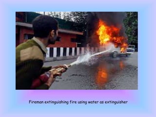 Fireman extinguishing fire using water as extinguisher
 