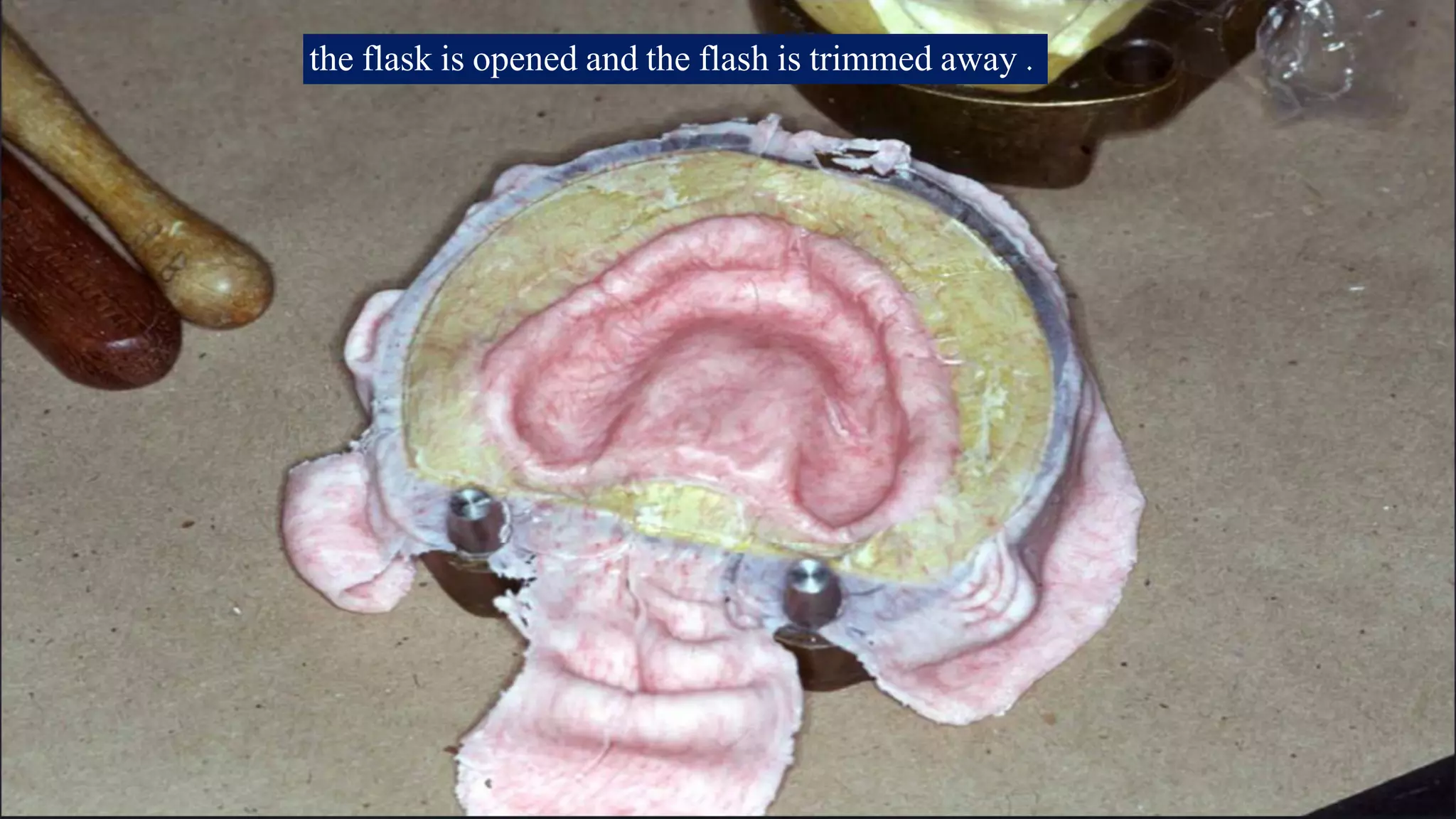 the flask is opened and the flash is trimmed away .

 