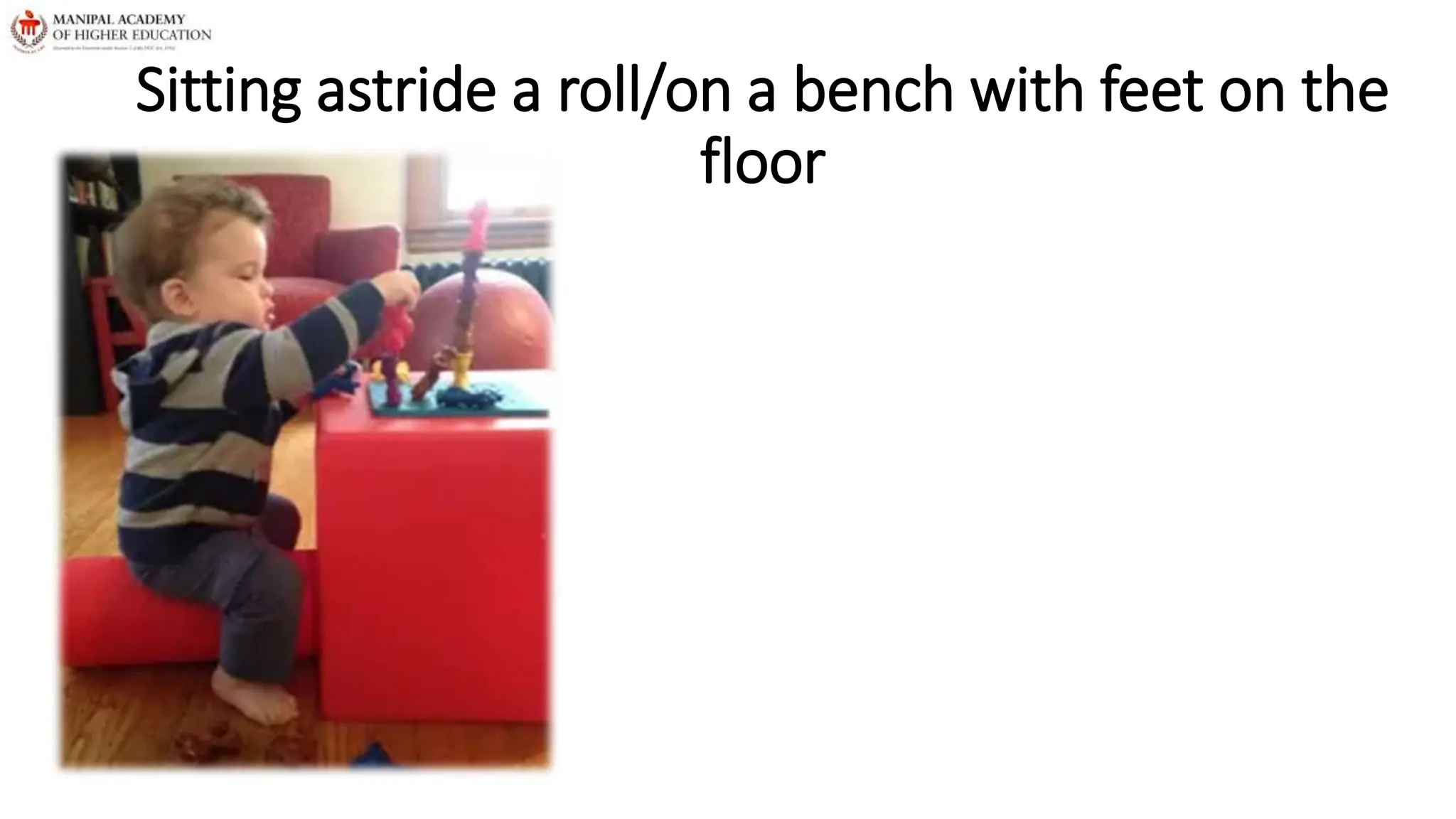 Sitting astride a roll/on a bench with feet on the
floor
 