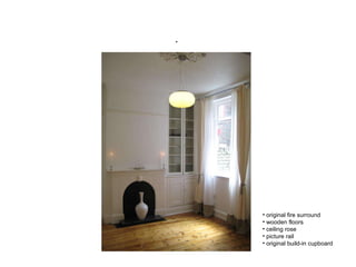    original fire surround wooden floors ceiling rose  picture rail original build-in cupboard 