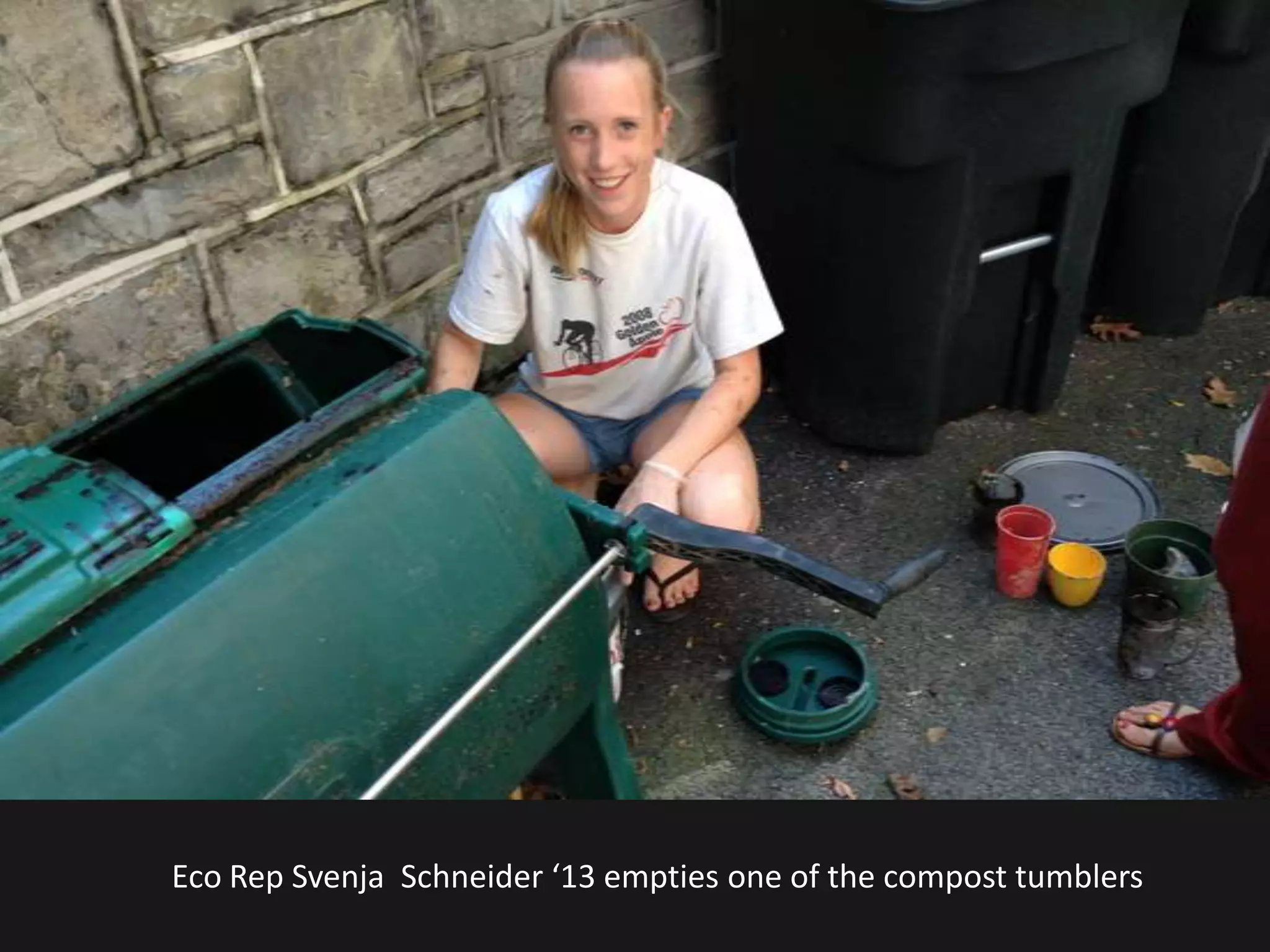 Eco Rep Svenja Schneider ‘13 empties one of the compost tumblers
 
