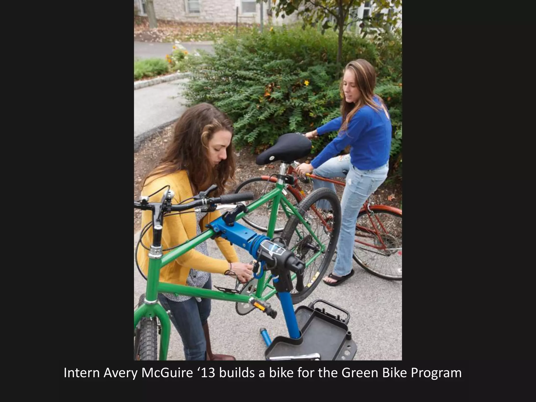Intern Avery McGuire ‘13 builds a bike for the Green Bike Program
 