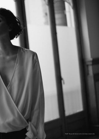 “RUBY” Blouse with sleeves multi cut and deep crossed collar
 