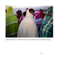 170
People wrap themselves in blankets to keep warm at a collection point in Morahalom, Hungary
 