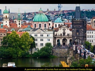 A permanent stream of tourists flock across the medieval Charles Bridge 