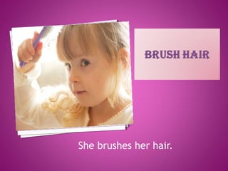 She brushes her hair.
 