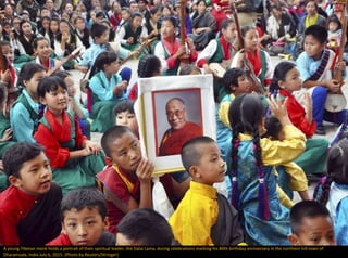 A young Tibetan monk holds a portrait of their spiritual leader, the Dalai Lama, during celebrations marking his 80th birthday anniversary in the northern hill town of
Dharamsala, India July 6, 2015. (Photo by Reuters/Stringer)
 