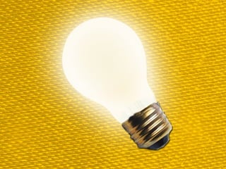 Boy with helmet and sword,
looking confusedly at a map
 