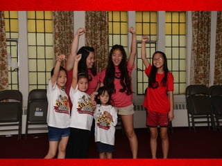 Several girls pumping fist in the
air
 