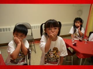 Kids covering their mouths
 