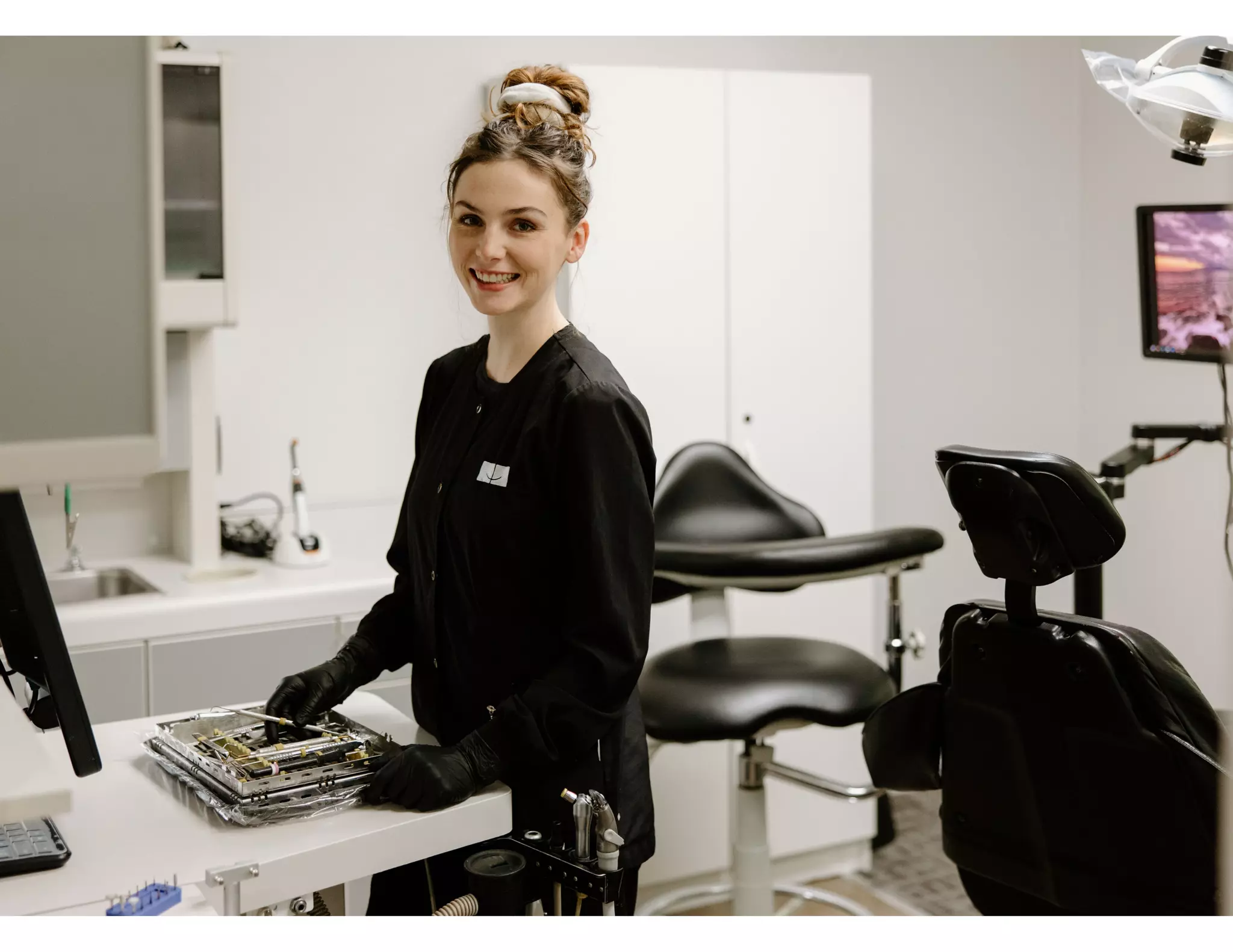 Dental hygienist preparing for root canal procedure at Vancouver ...