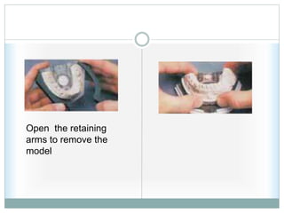 Open the retaining
arms to remove the
model
 