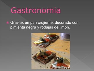  Gravlax en pan crujiente, decorado con
pimienta negra y rodajas de limón.
 