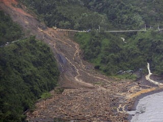 TYPHOON MORAKOT: TAIWAN;
LANDSLIDE BURIES VILLAGE
OF 1,000
 