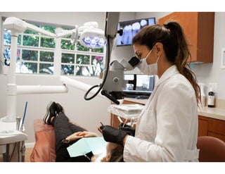 Dr. Adriana Echenagucia with Microscope at One Dental Studio