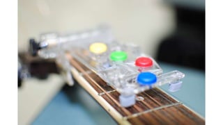 Adaptive Device For Playing Instruments Assistive Guitar Device | PPTX
