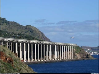 What distinctive feature does the Madeira Airport in Portugal
have?
a. It is on an artificial island
b. It has a beach beneath the landing approach
c. Its runway is supported by columns
 