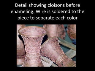 This slide shows a girl meticulously adding frit to areas, the piece will be kiln fired, then ground and polished.