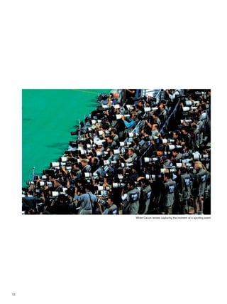 23
White Canon lenses capturing the moment at a sporting event
 