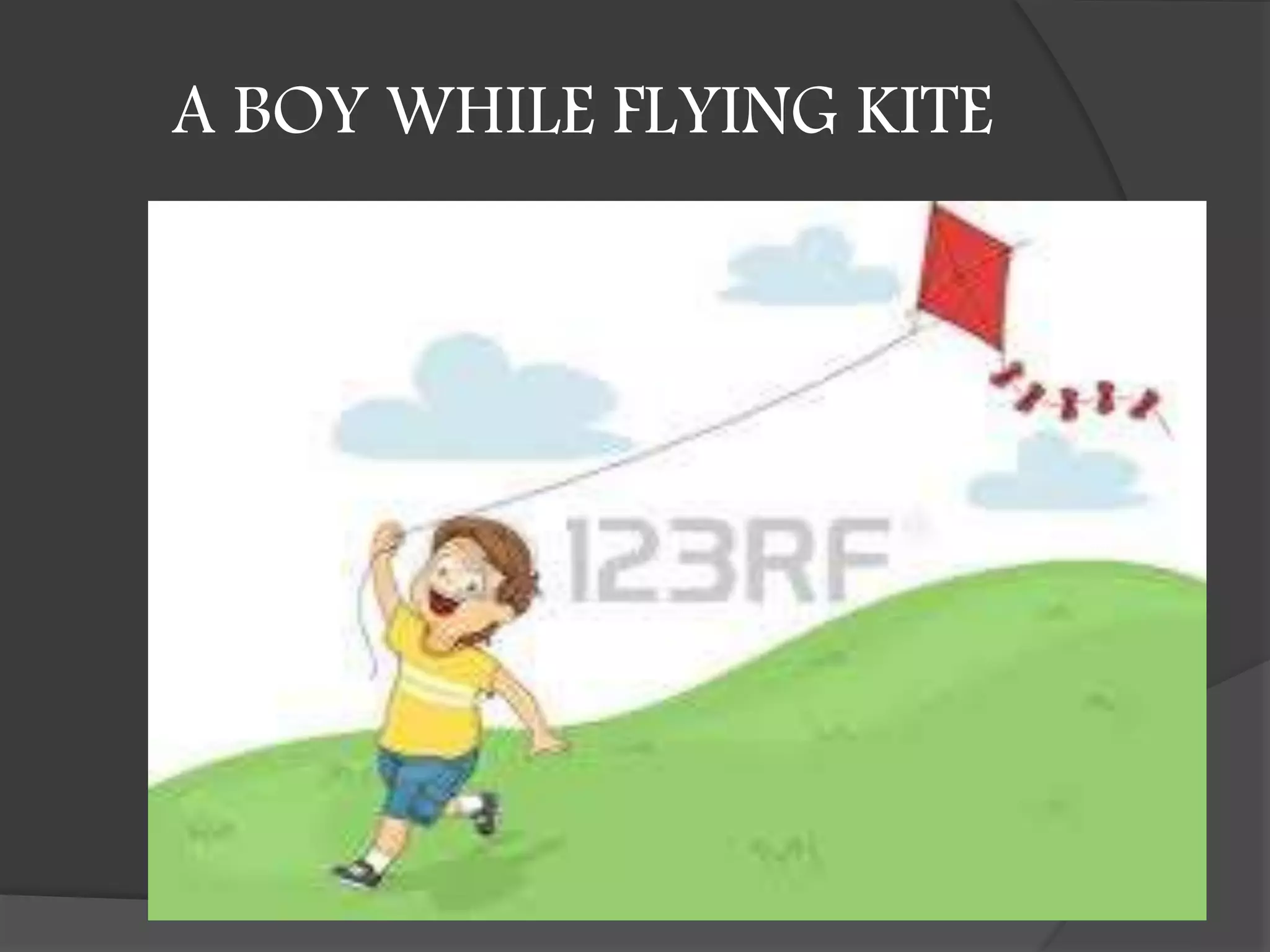 A BOY WHILE FLYING KITE
 