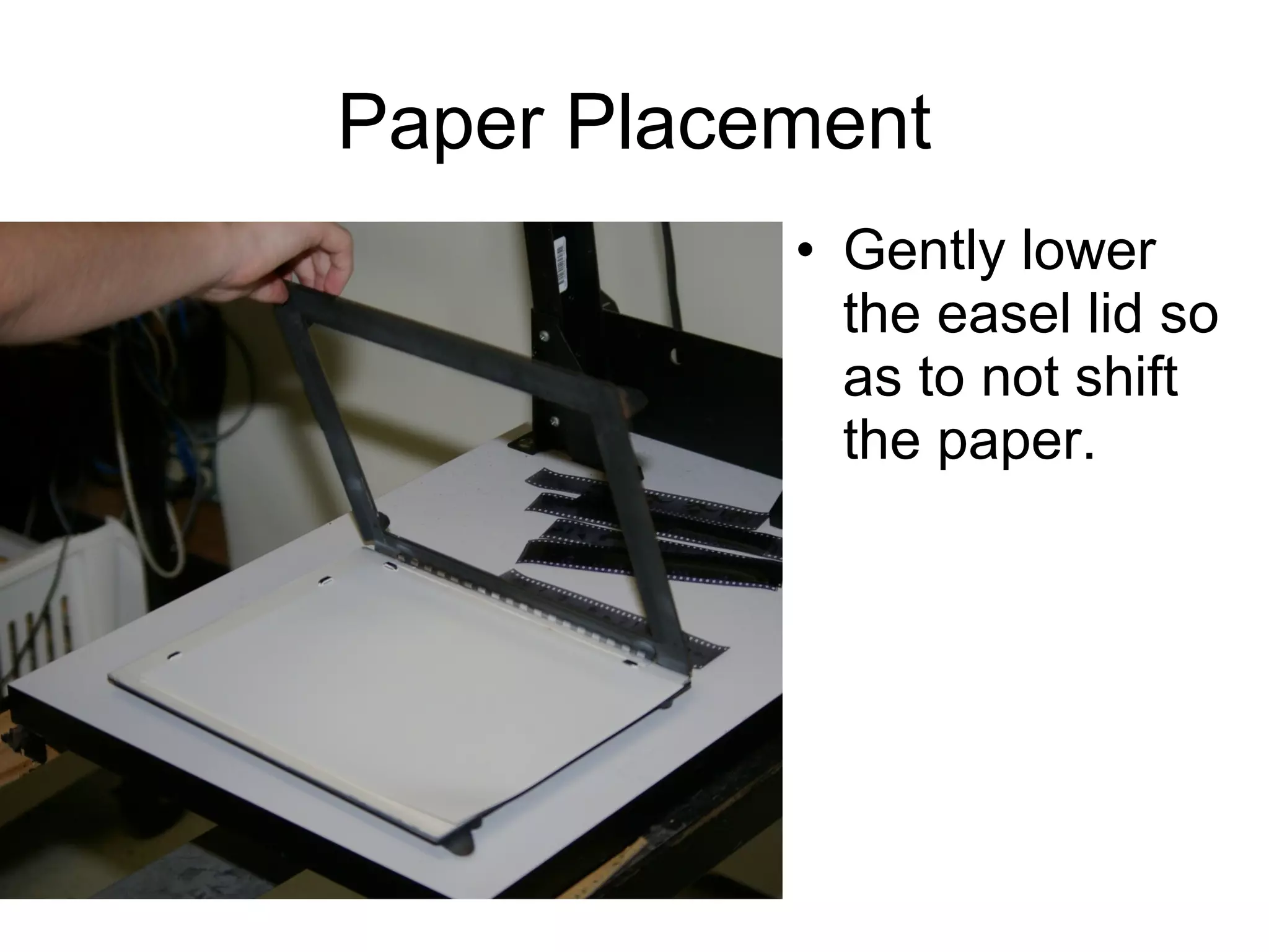 Paper Placement
• Place paper
against all 4
black tabs
• Slide the paper
back and forth to
make sure you
are up against all
4 tabs.

 