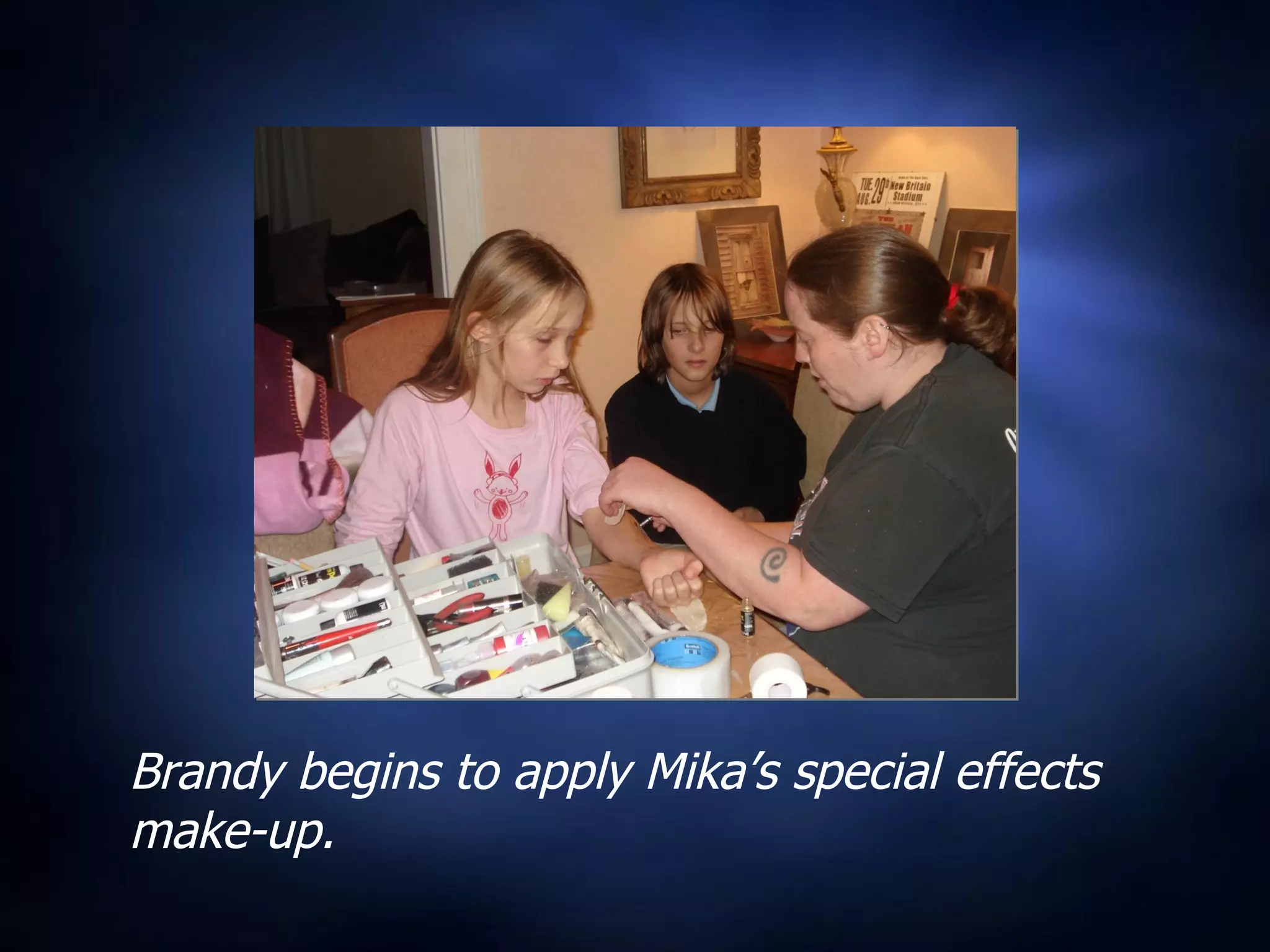 Brandy begins to apply Mika’s special effects make-up. 