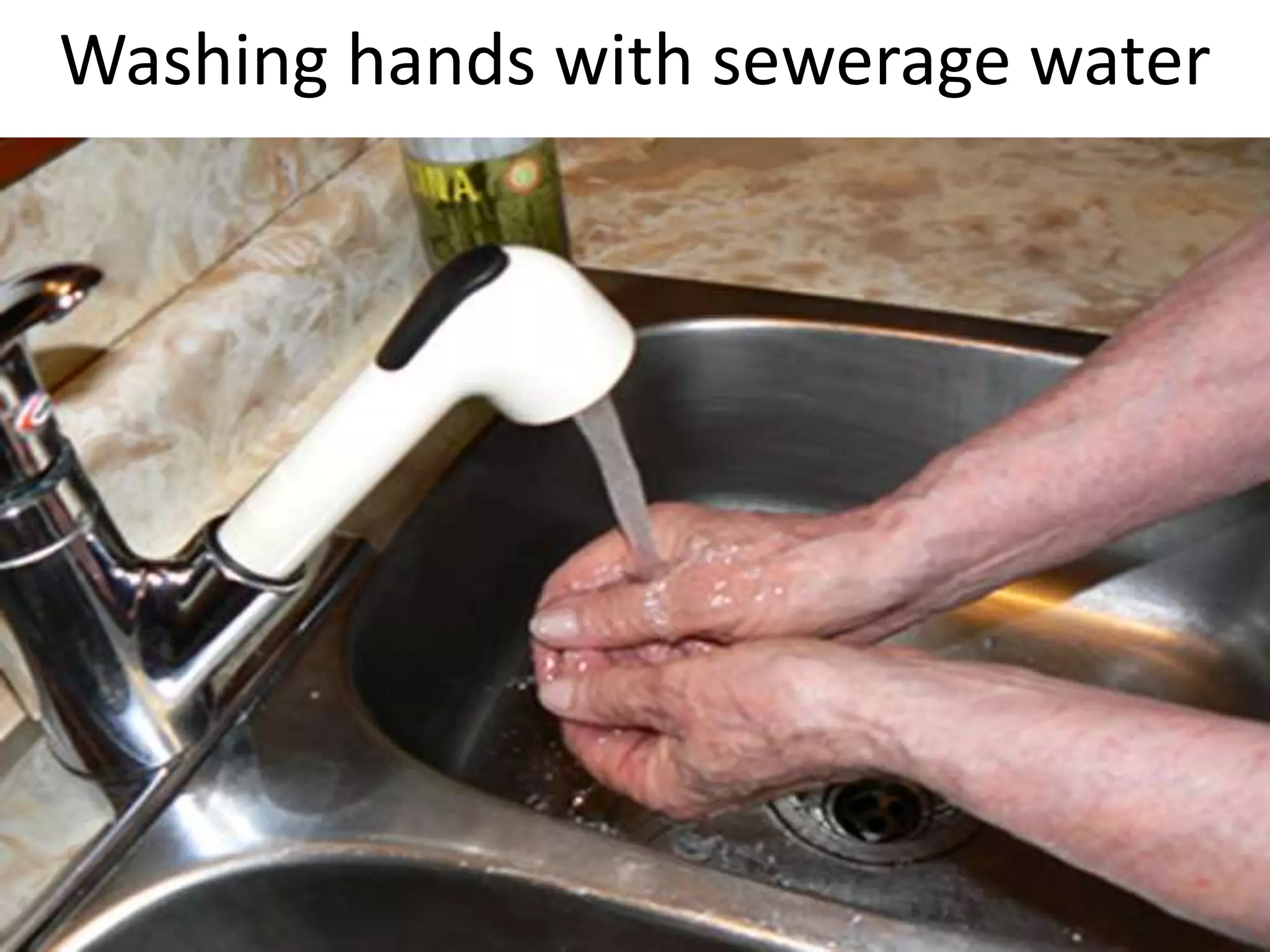 Washing hands with sewerage water
 