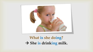 What is she doing?
 She is drinking milk.
 
