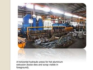 A horizontal hydraulic press for hot aluminum
extrusion (loose dies and scrap visible in
foreground).

 