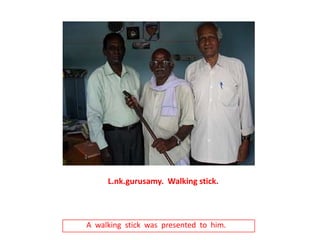 L.nk.gurusamy.  Walking stick.A  walking  stick  was  presented  to  him.