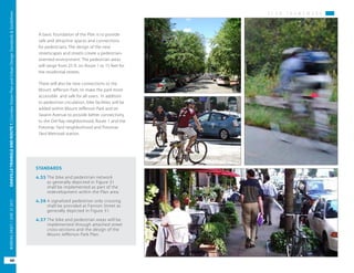 P L A N F R A M E W O R K
OAKVILLETRIANGLEANDROUTE1|CorridorVisionPlanandUrbanDesignStandards&Guidelines
60
WORKINGDRAFT/JUNE2015OAKVILLETRIANGLEANDROUTE1|CorridorVisionPlanandUrbanDesignStandards&Guidelines
60
WORKINGDRAFT/JUNE252015
A basic foundation of the Plan is to provide
safe and attractive spaces and connections
for pedestrians. The design of the new
streetscapes and streets create a pedestrian-
oriented environment. The pedestrian areas
will range from 25 ft. on Route 1 to 15 feet for
the residential streets.
There will also be new connections to the
Mount Jefferson Park, to make the park more
accessible and safe for all users. In addition
to pedestrian circulation, bike facilities will be
added within Mount Jefferson Park and on
Swann Avenue to provide better connectivity
to the Del Ray neighborhood, Route 1 and the
Potomac Yard neighborhood and Potomac
Yard Metrorail station.
STANDARDS
4.35	The bike and pedestrian network
as generally depicted in Figure 31
shall be implemented as part of the
redevelopment within the Plan area.
4.36	A signalized pedestrian only crossing
shall be provided at Fannon Street as
generally depicted in Figure 31.
4.37	The bike and pedestrian areas will be
implemented through attached street
cross-sections and the design of the
Mount Jefferson Park Plan.
 