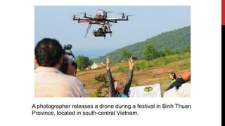 A photographer releases a drone during a festival in Binh Thuan
Province, located in south-central Vietnam.
 