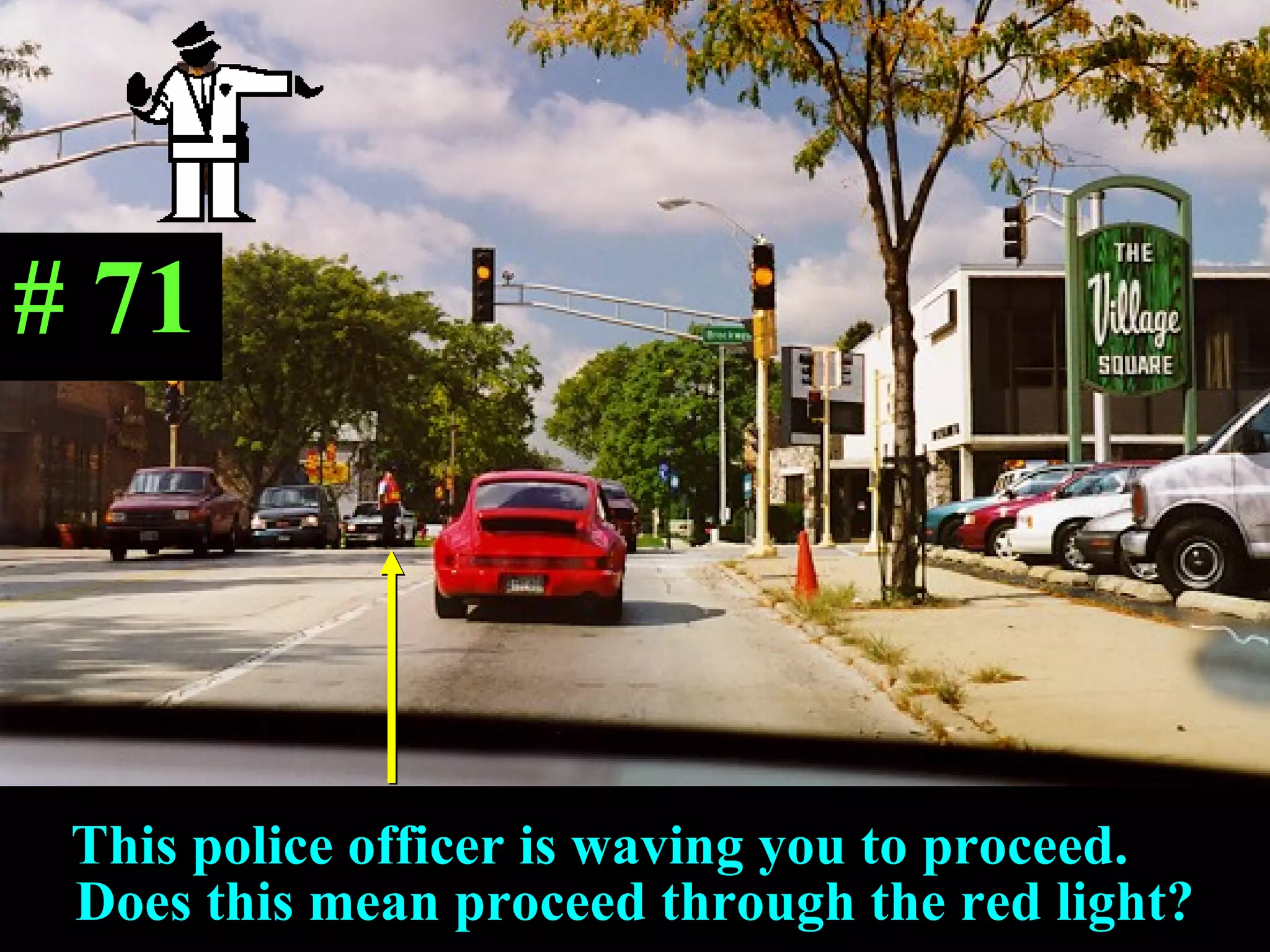This police officer is waving you to proceed.  Does this mean proceed through the red light? # 71 