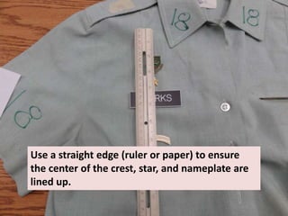 Use a straight edge (ruler or paper) to ensure
the center of the crest, star, and nameplate are
lined up.
 