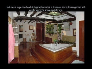 Includes a large overhead skylight with mirrors, a fireplace, and a dressing room with ample wardrobe space and storage. 