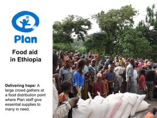 Food aid  in Ethiopia Delivering hope:   A large crowd gathers at a food distribution point where Plan staff give essential supplies to many in need. 