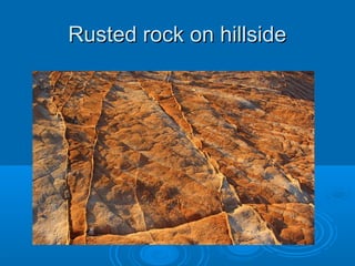 Rusted rock on hillside
 