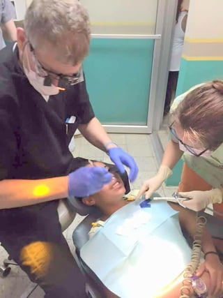 Fort wayne dentist steven ellinwood, dds at work in his dental clinic
