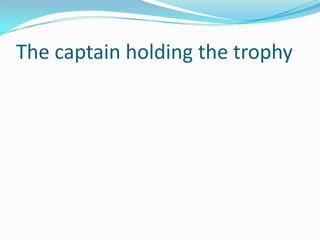 The captain holding the trophy