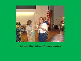 Secretary blows bubbles; President looks on