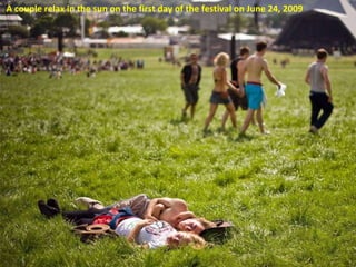A couple relax in the sun on the first day of the festival on June 24, 2009 