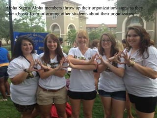 Alpha Sigma Alpha members throw up their organizations signs as they
take a break from informing other students about their organization.
 