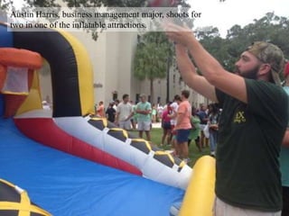 Austin Harris, business management major, shoots for
two in one of the inflatable attractions.
 