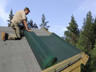 Membrane being rolled out. 