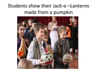 Students show their Jack-o –Lanterns
made from a pumpkin
 