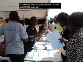 An exhibitor explaining to participants as they
get IEC/BCC materials
 