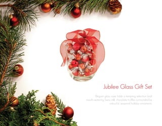 Jubilee Glass Gift Set
Elegant glass vase holds a tempting selection Lindt
mouth-watering Swiss milk chocolate truffles surrounded by
colourful, seasonal holiday ornaments.

 