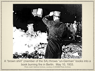 A “brown shirt” (member of the SA) throws “un-German” books into a book burning fire in Berlin.  May 10, 1933. Photo credit: National Archives, courtesy of USHMM Photo Archives 