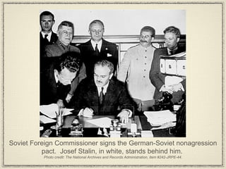 Soviet Foreign Commissioner signs the German-Soviet nonagression pact.  Josef Stalin, in white, stands behind him.  Photo credit: The National Archives and Records Administration, item #242-JRPE-44. 