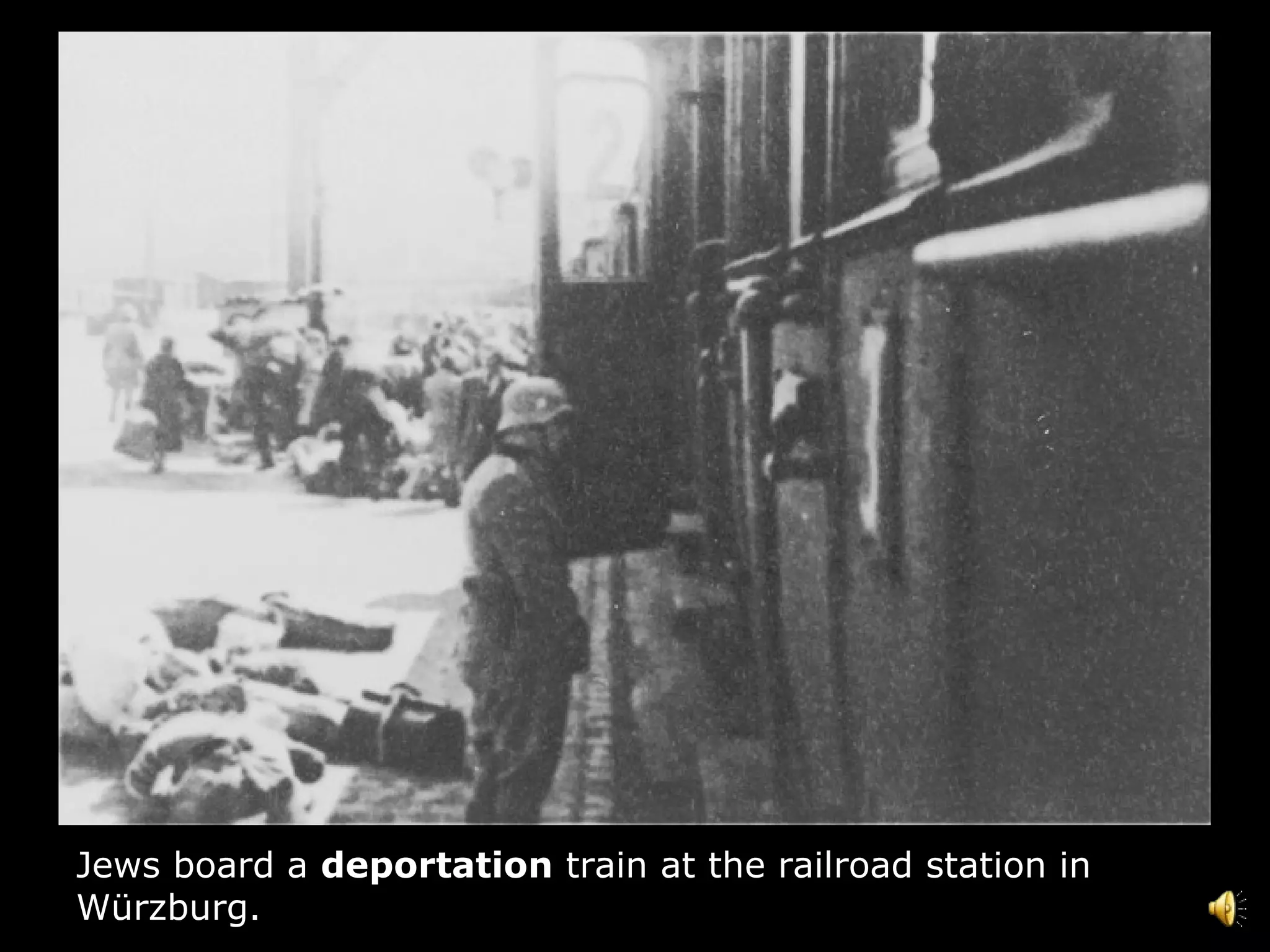 Jews board a  deportation  train at the railroad station in Würzburg.  